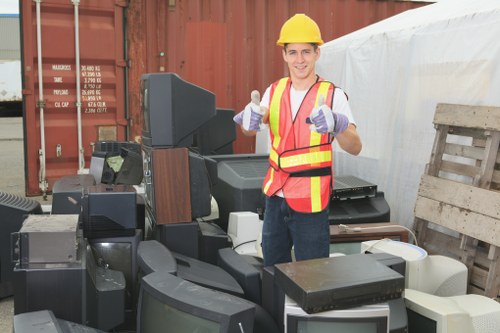 Construction site with builders managing waste